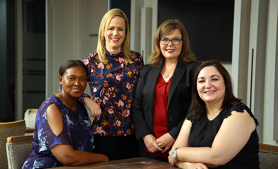 Lisl Fair (second from right) with SRK’s social transitioning during mine closure core team (From right) Adel Malebana, Ashleigh Maritz and Jessica Edwards